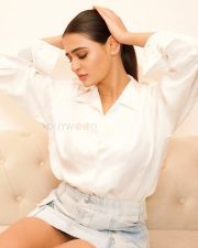 Minimalist Beauty Prakriti Pavani in a White Oversized Shirt and a Faded Denim Micro Skirt Photos 02