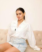 Minimalist Beauty Prakriti Pavani in a White Oversized Shirt and a Faded Denim Micro Skirt Photos 03