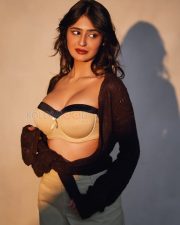 Modern Prakriti Pavani in a Beige Strapless Corset Top with a Dark Brown Grey Open Knit Cardigan and Light Trousers Pictures 02
