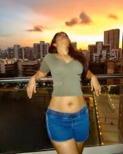 Radiant Nikita Sharma Cleavage in a Olive Green Deep V Crop Top Photos 04