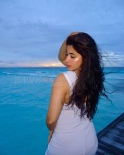 Radiant Nikita Sharma Cleavage in a White Deep V Halter Bodycon Dress Photos 04