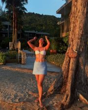 Romantic Tripti Dimri in a White Bikini Top with a Light Blue Mini Skirt Vacation Photos 04