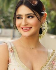 Sensual Prakriti Pavani in an Ivory and Gold Embroidered Lehenga Saree with a Sleeveless Deep V Neck Blouse Photos 03