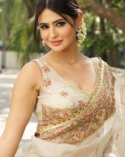 Sensual Prakriti Pavani in an Ivory and Gold Embroidered Lehenga Saree with a Sleeveless Deep V Neck Blouse Photos 04