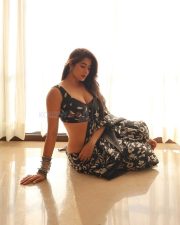 Sensuous Nikita Sharma in a Black Floral Saree with a Black Sleeveless Blouse Stills 01