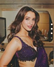 Sensuous Tripti Dimri in a Vibrant Purple Saree with a Sleeveless Deep Cleavage Blouse Photos 03