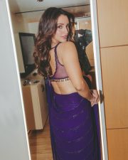 Sensuous Tripti Dimri in a Vibrant Purple Saree with a Sleeveless Deep Cleavage Blouse Photos 08