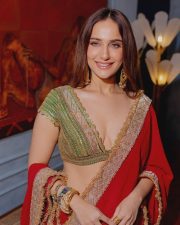 Sexy Actress Kusha Kapila in a Vibrant Red Saree with a Green Plunging Neckline Blouse Photos 01