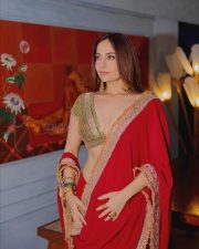 Sexy Actress Kusha Kapila in a Vibrant Red Saree with a Green Plunging Neckline Blouse Photos 03