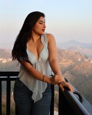 Sexy Actress Nikita Sharma in a Powder Blue Mist Top with a Deep Cleavage and Dark Blue Denim Jeans Photos 03