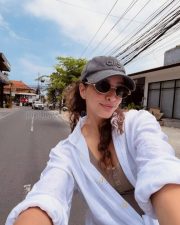 Spirited Actress Tripti Dimri in a White Linen Shirt Grey Cap Sunglasses Photos 04