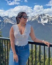 Stunning Nikita Sharma in a White Lace Top and Blue Denim Jeans Photos 02