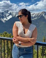 Stunning Nikita Sharma in a White Lace Top and Blue Denim Jeans Photos 03