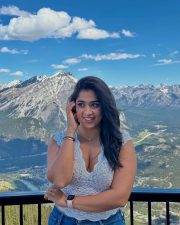 Stunning Nikita Sharma in a White Lace Top and Blue Denim Jeans Photos 04