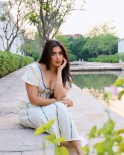 Stylish Actress Nikita Sharma in a White Off Shoulder Midi Dress Photos 01