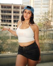 Stylish Actress Prakriti Pavani in a White Halter Crop Top and Denim Skirt Photos 03