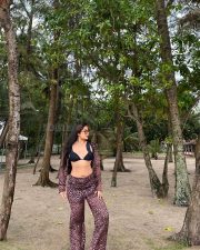 Stylish Indian Television Actress Nikita Sharma in a Black Bikini Top with a Sheer Cover Up Top and High Waisted Flare Pants Photos 02