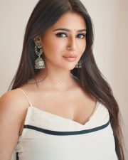 Stylish Prakriti Pavani in a Minimalist White Saree with a Contrasting Black Border and White Sleeveless Blouse Pictures 02