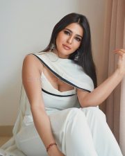 Stylish Prakriti Pavani in a Minimalist White Saree with a Contrasting Black Border and White Sleeveless Blouse Pictures 05