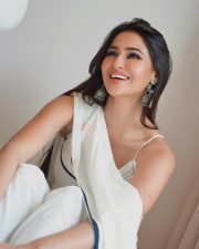Stylish Prakriti Pavani in a Minimalist White Saree with a Contrasting Black Border and White Sleeveless Blouse Pictures 06