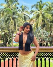 Sultry Nikita Sharma Cleavage in a Black Halter Top Yellow Skirt Photos 01