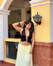 Sultry Nikita Sharma Cleavage in a Black Halter Top Yellow Skirt Photos 02