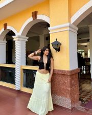 Sultry Nikita Sharma Cleavage in a Black Halter Top Yellow Skirt Photos 07