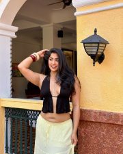 Sultry Nikita Sharma Cleavage in a Black Halter Top Yellow Skirt Photos 10