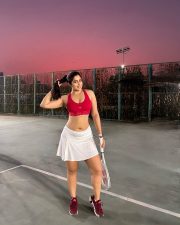 Tempting Nikita Sharma in a Red Racerback Sports Bra with a White Tennis Skirt Pictures 01