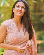 Dada Movie Actress Aparna Das in a Peach Saree with Glass Neck Blouse Photos 02