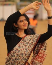 Elegant Actress Manasa Varanasi in a Orange Border Block Print Saree with Black Full Sleeve Blouse Photos 01