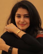 Elegant Actress Manasa Varanasi in a Orange Border Block Print Saree with Black Full Sleeve Blouse Photos 02