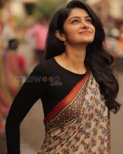 Elegant Actress Manasa Varanasi in a Orange Border Block Print Saree with Black Full Sleeve Blouse Photos 04