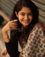 Elegant Actress Manasa Varanasi in a Orange Border Block Print Saree with Black Full Sleeve Blouse Photos 05