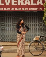 Elegant Actress Manasa Varanasi in a Orange Border Block Print Saree with Black Full Sleeve Blouse Photos 08