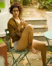 Adorable Megha Shukla in a Mustard Brown Shirt and Boy Shorts Photos 01