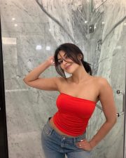 Alluring Actress Yesha Sagar in a Red Tube Top and Blue Jeans Photos 01