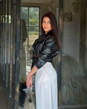 Attractive Punjabi Model Yesha Sagar in a Cropped Black Leather Biker Jacket with a Wide Leg Ivory Trousers Photos 04
