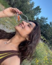 Cute Kanika Mann in a Retro Yellow Striped Sleeveless Top Photos 01