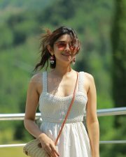 Cute Kanika Mann in a White Shoulder Straps Sleeveless Maxi Dress with Brown Boots Photos 02