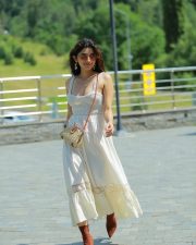 Cute Kanika Mann in a White Shoulder Straps Sleeveless Maxi Dress with Brown Boots Photos 04