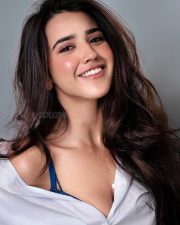 Dazzling Actress Roshni Walia in a white linen short sleeve button up shirt photos 04