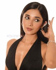 Eye catching Kanika Mann Legs in a Black Floral Halter Mini Dress Photos 05