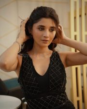 Fashionable Actress Kanika Mann in a black quilted halter neck dress photos 02