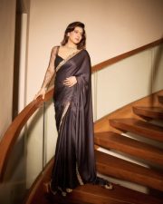 Maharagni Queen of Queens Actress Kajol Devgan in a Black Satin Saree with a Sheer Full Sleeved Lace Blouse Photos 03
