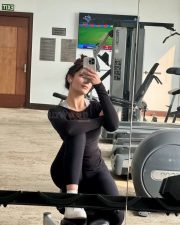 Punjabi Model and Actress Yesha Sagar in a Monochrome Black Long Sleeved Athletic Top with a Matching High Waisted Leggings Photos 03