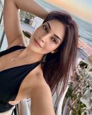 Radiant Actress Yesha Sagar in a Black Halter Neck Swimsuit Photos 01