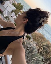 Radiant Actress Yesha Sagar in a Black Halter Neck Swimsuit Photos 02
