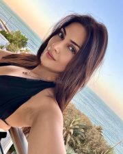Radiant Actress Yesha Sagar in a Black Halter Neck Swimsuit Photos 03