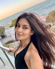 Radiant Actress Yesha Sagar in a Black Halter Neck Swimsuit Photos 04